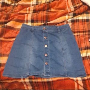 denim skirt with gold buttons down the middle.